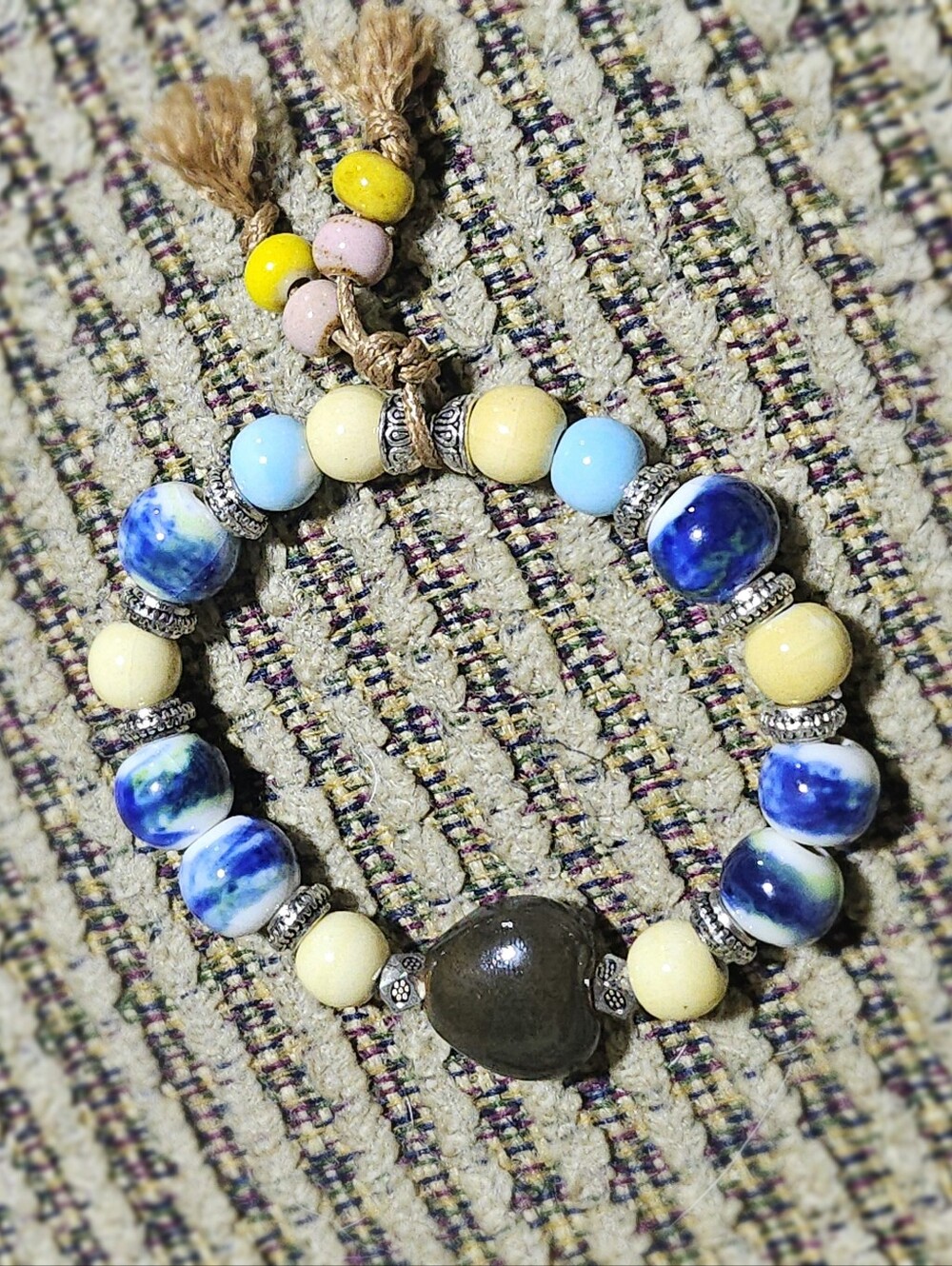 Handcrafted Blue and Cream Beaded Stretch Bracelet with Tassel